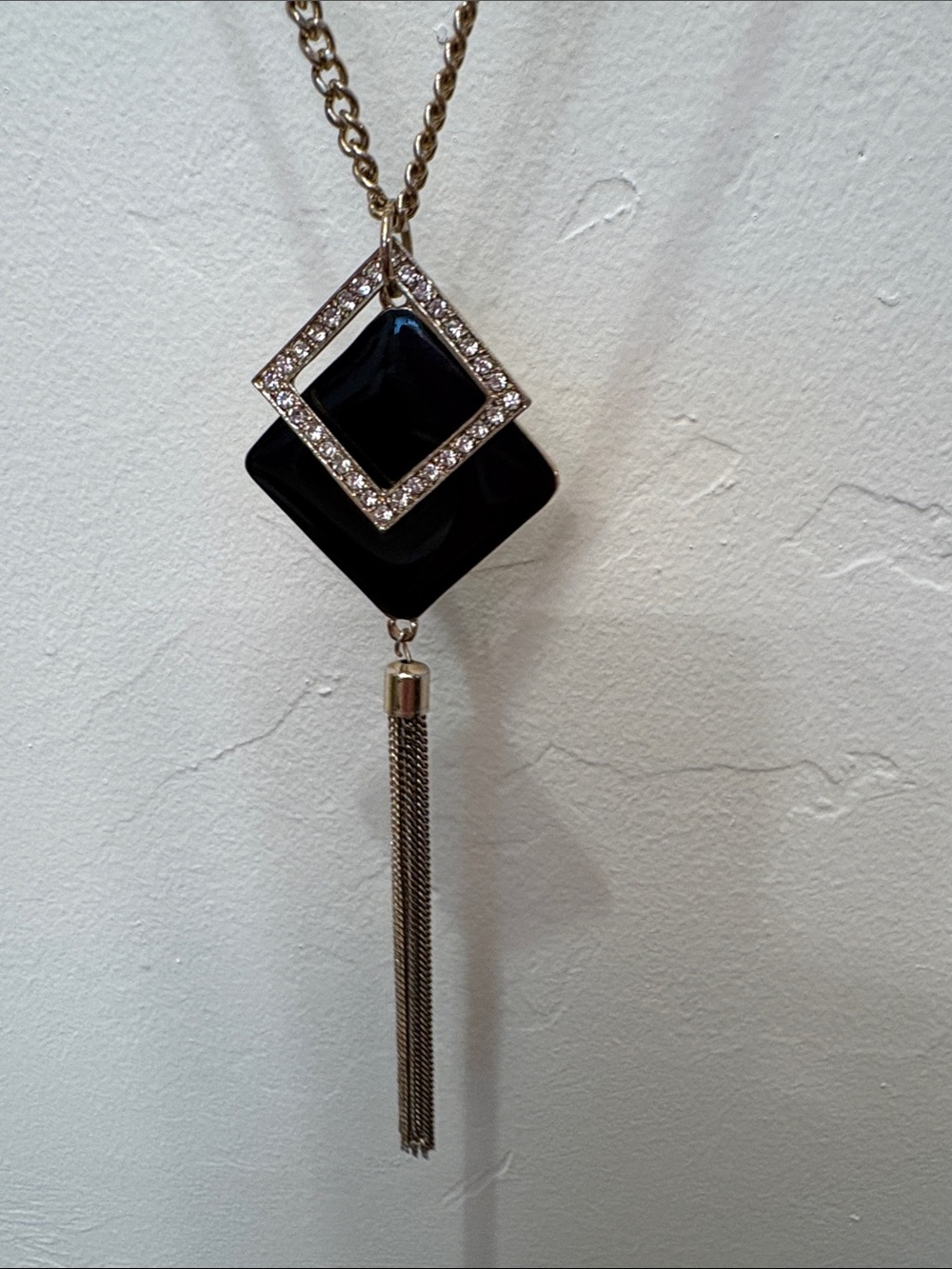 Black, gold tone and rhinestone necklace.